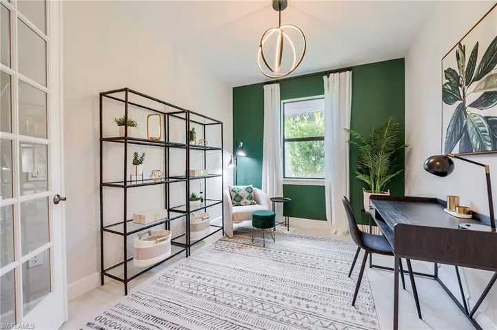 Office area featuring french doors and an inviting chandelier