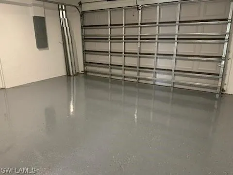Garage featuring electric panel