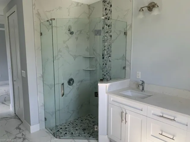 Bathroom with vanity and an enclosed shower