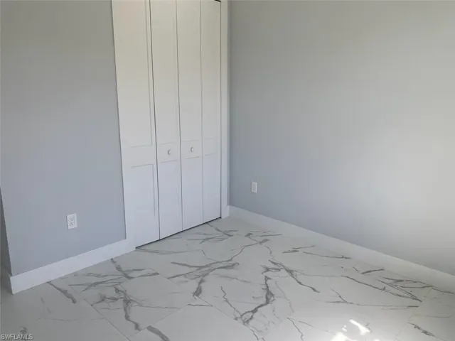 Unfurnished bedroom with a closet