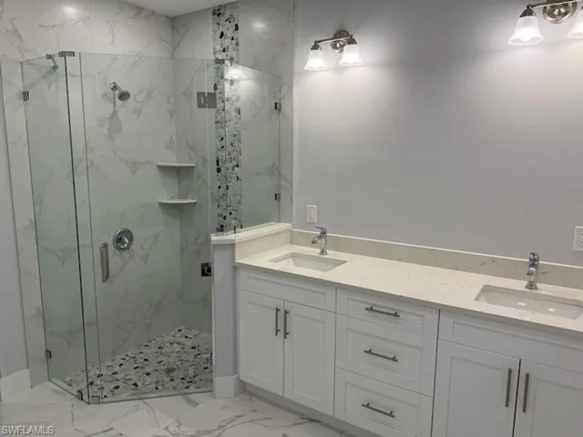 Bathroom with vanity and walk in shower