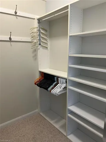 Primary bedroom walk in closet