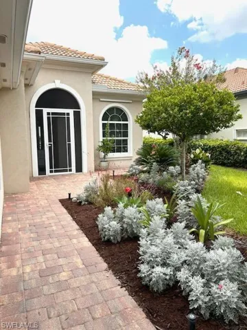 Outdoor landscaping along walkway to front door