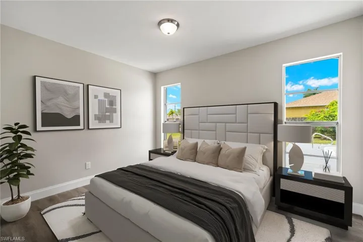 Bedroom with hardwood / wood-style floors