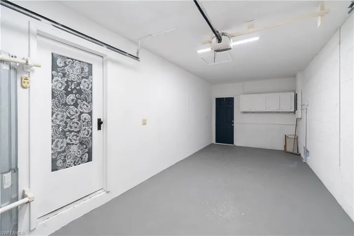 Garage featuring a garage door opener