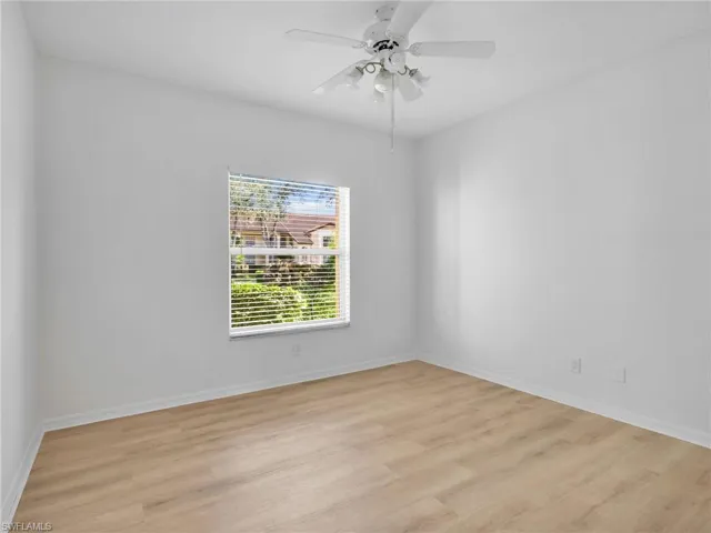 Spare room with light wood-style flooring and a ceiling fan