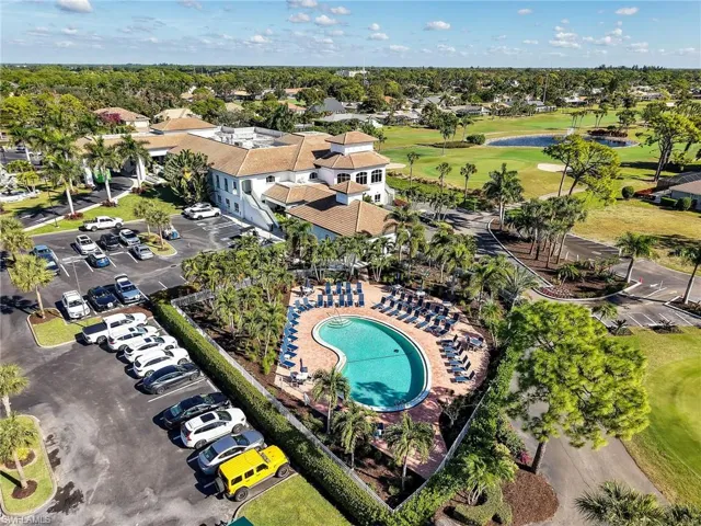 View of property location with a local golf course and a large body of water