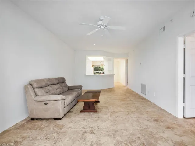 Living area featuring a ceiling fan