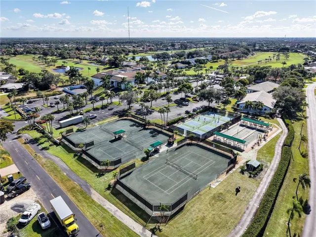 Bird's eye view of a golf course and a large body of water