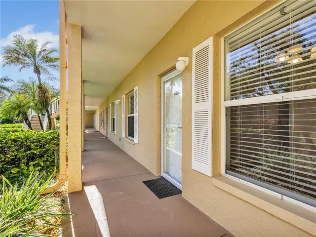 View of exterior entry with stucco siding