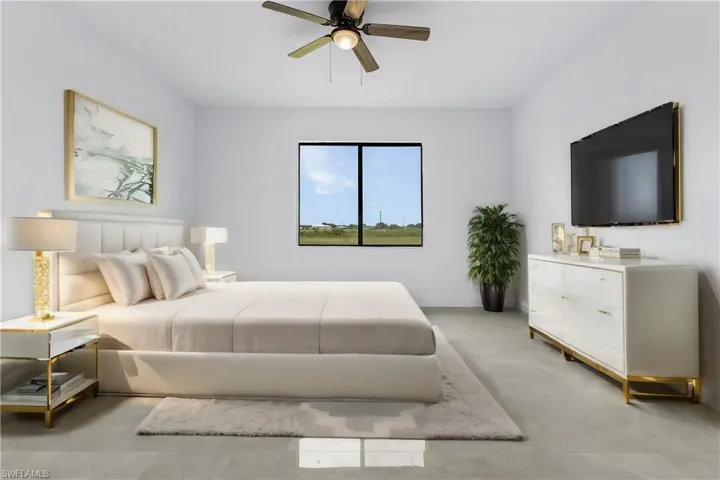 Tiled bedroom featuring ceiling fan