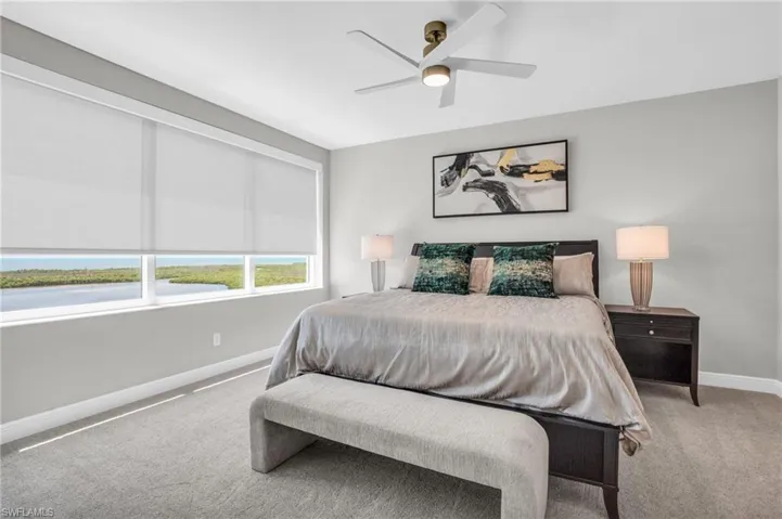 Bedroom with carpet flooring and ceiling fan