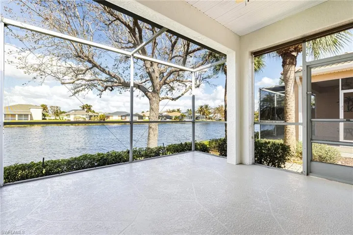 Unfurnished sunroom featuring a water view