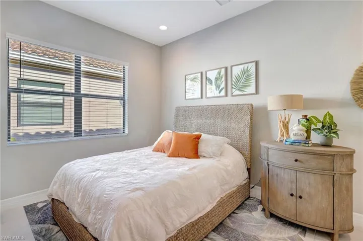 Bedroom with light tile patterned floors, recessed lighting, and baseboards