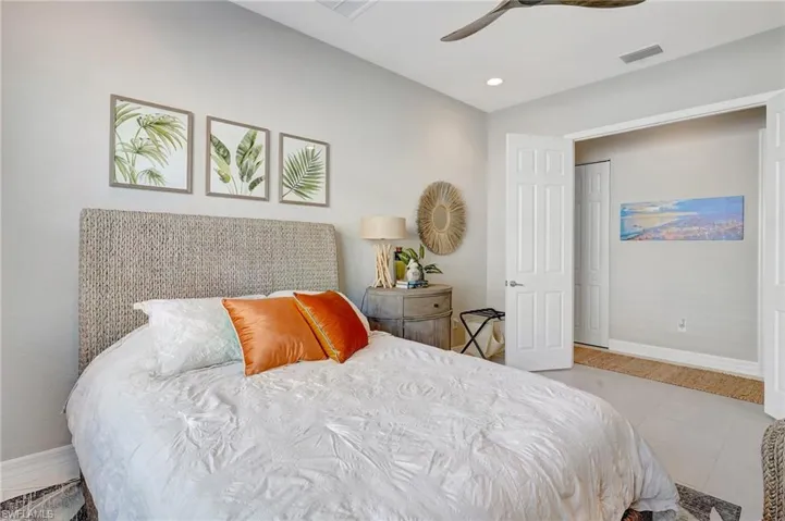 Bedroom featuring visible vents, baseboards, ceiling fan, tile patterned flooring, and recessed lighting