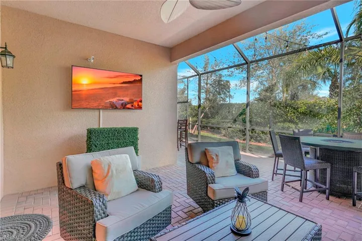 Sunroom with a ceiling fan
