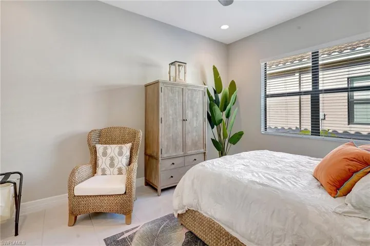 Bedroom with recessed lighting, baseboards, and light tile patterned floors