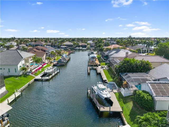 Aerial perspective of suburban area featuring a large body of water