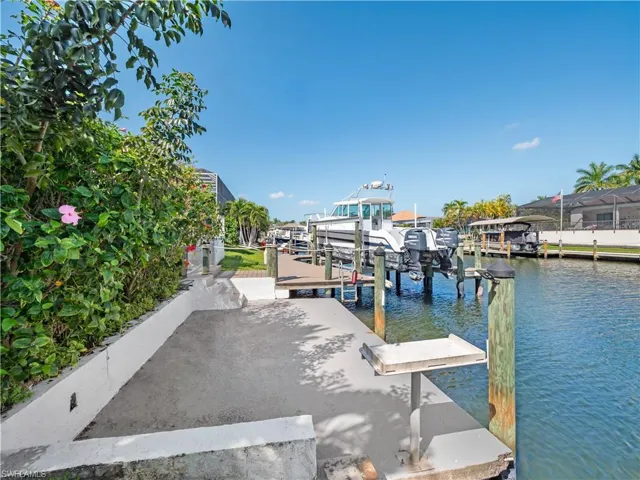 Dock featuring a water view and boat lift