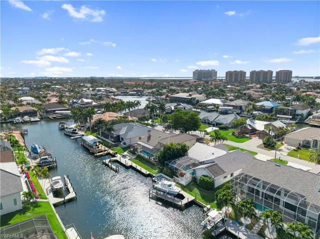 Aerial perspective of suburban area with a nearby body of water