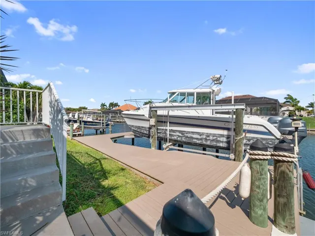 Dock with a water view and boat lift