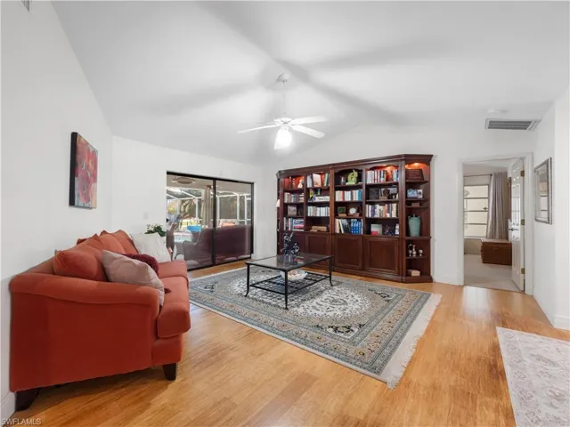 Living area featuring light wood-style flooring and ceiling fan