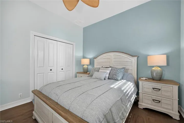 Wood-finish flooring complements the light blue wall