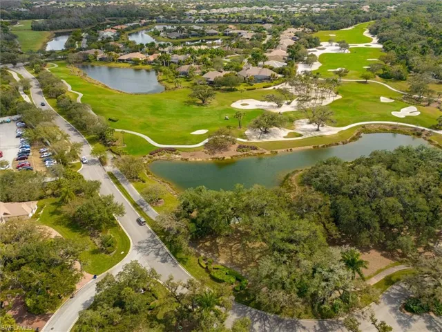 Aerial perspective showcasing a golf course environment with multiple water features