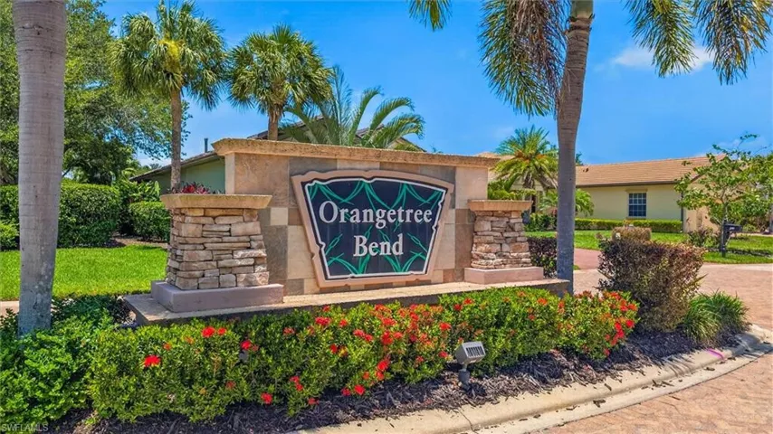 Orangetree Bend community entrance sign featuring stone veneer and tropical landscaping