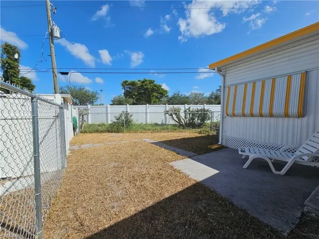 Fenced backyard featuring a patio