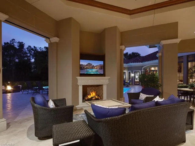 View of patio featuring an outdoor living space with fireplace