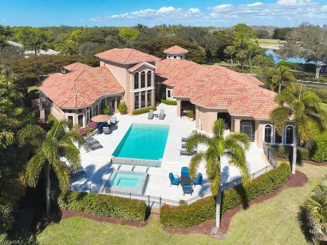 View of swimming pool featuring patio surround, an in-ground hot tub, french doors, and outdoor dining area
