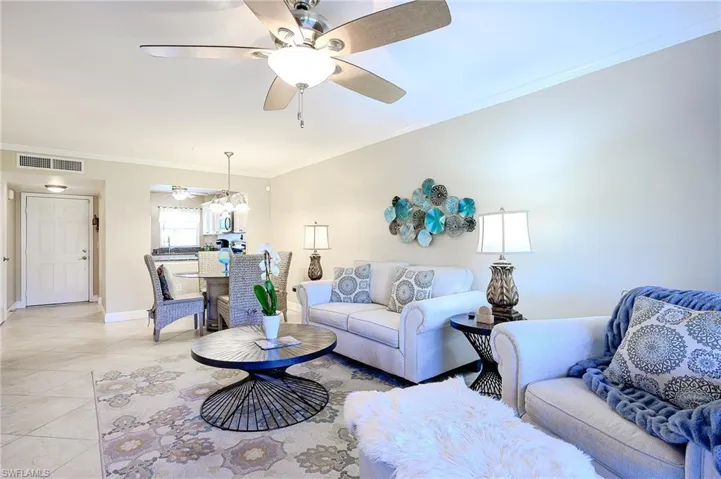 Living room with fan and light.