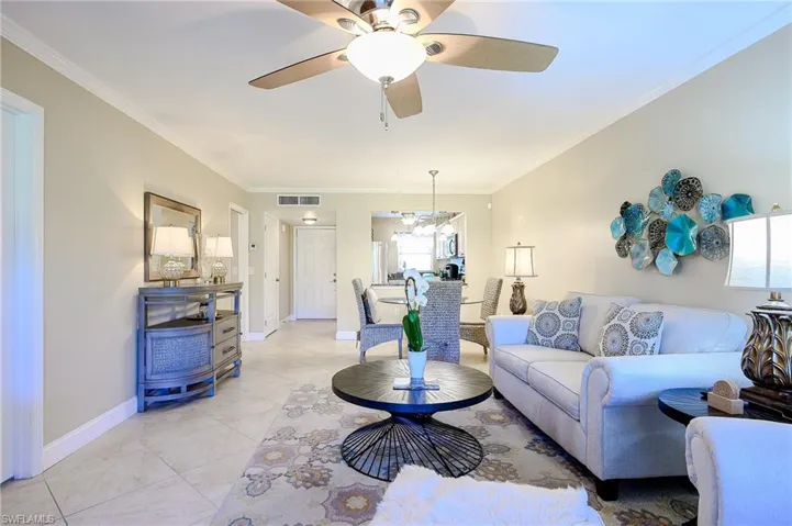 Living room and dining room and crown molding and very spacious