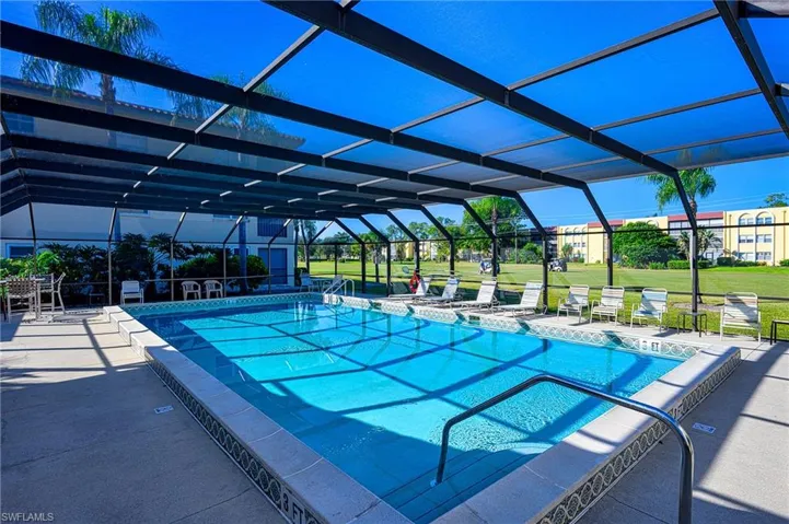 Community pool with screen enclosure. Bathroom ,too