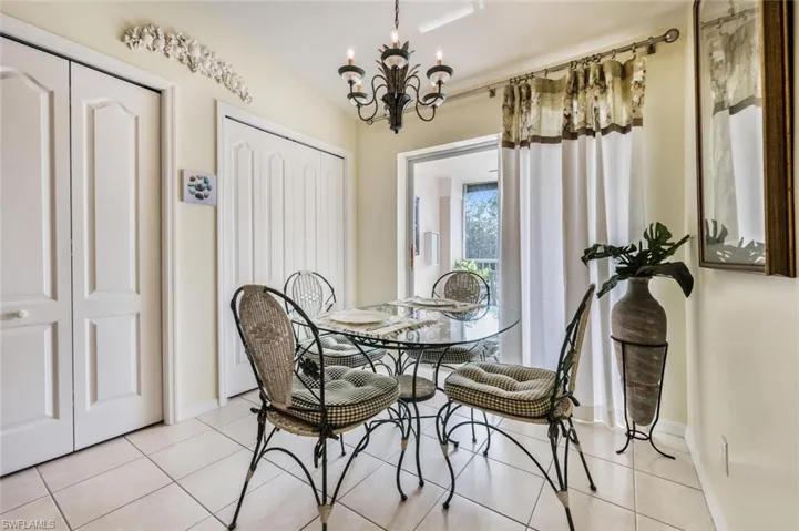 Dining room featuring a chandelier and tile patterned flooring