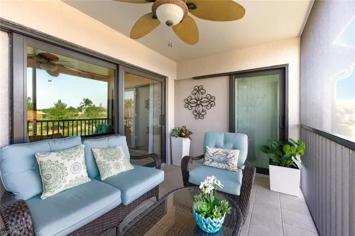 Sunroom featuring ceiling fan and outdoor lounge area