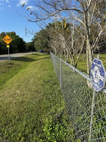 View of yard featuring fence