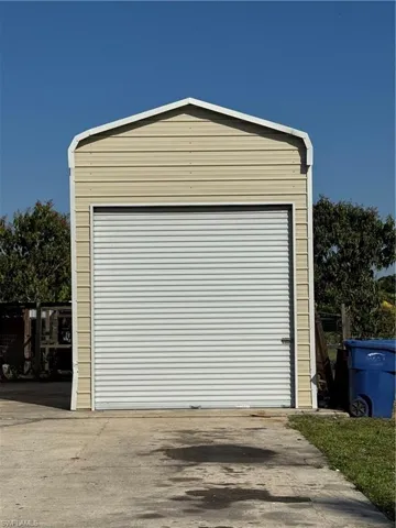 Garage with concrete driveway