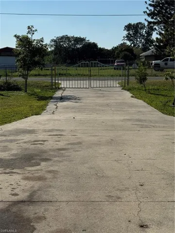 View of gate featuring fence