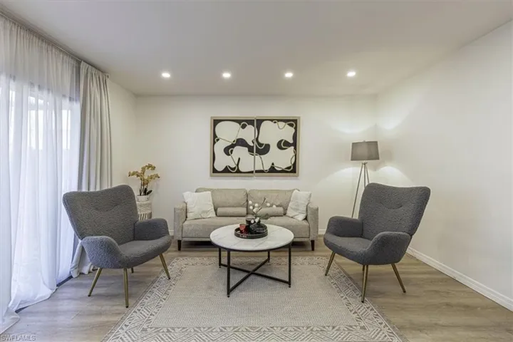Living area featuring recessed lighting and light wood-style flooring