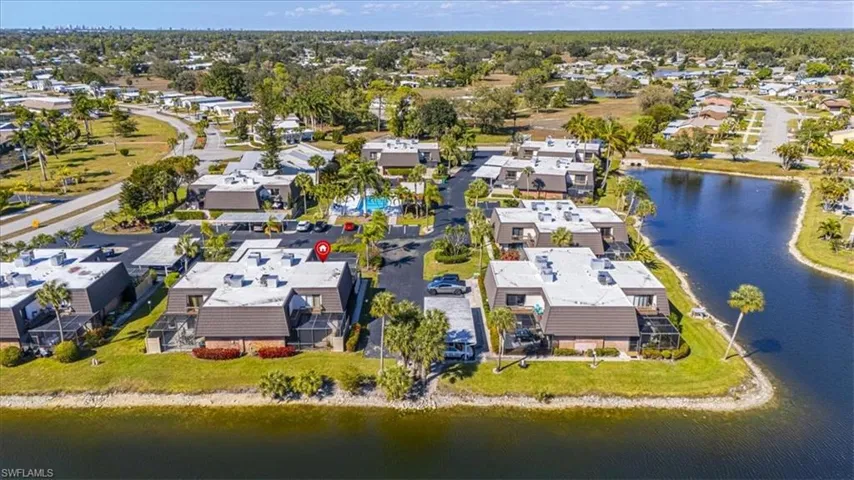 Aerial overview of property's location with a nearby body of water