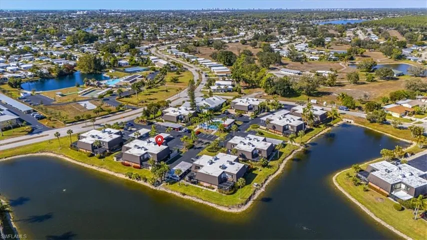 Aerial view of property's location with nearby suburban area