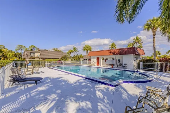 Community pool with a patio