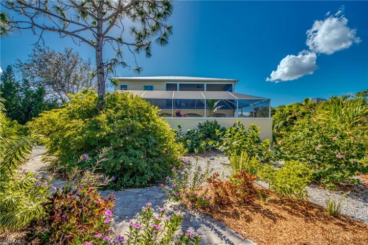 Back of house with a lanai