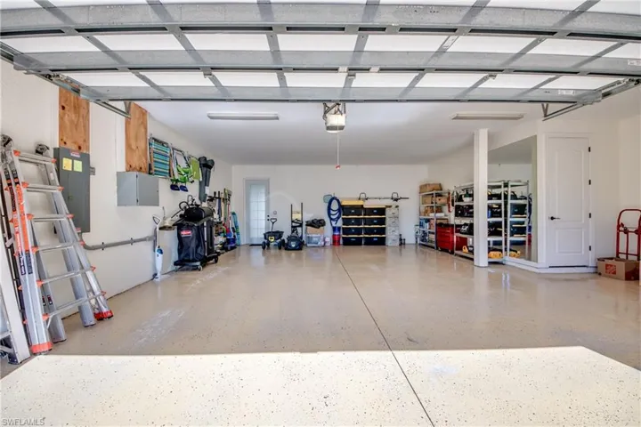 Garage with a garage door opener and electric panel