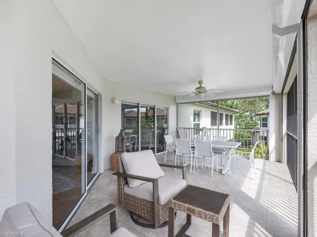 Sunroom featuring ceiling fan
