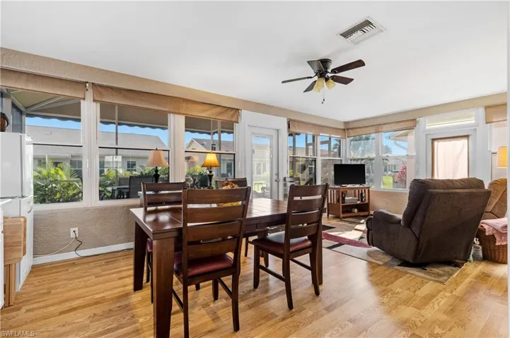 Dining room featuring ceiling fan and light wood-type flooring