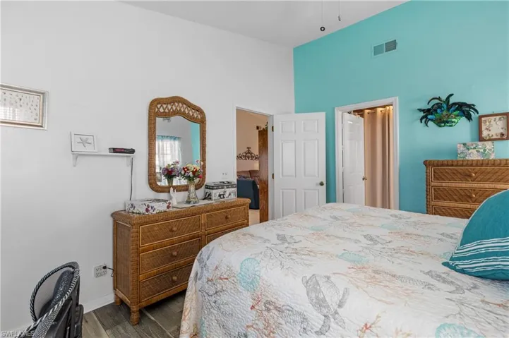 Bedroom with hardwood / wood-style floors