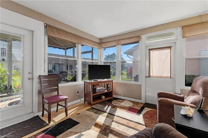 Sunroom featuring plenty of natural light